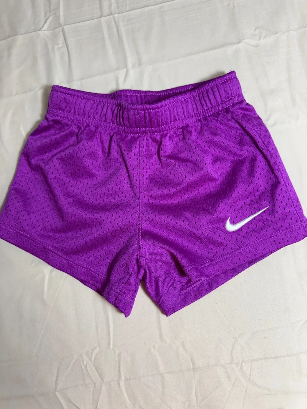 Nike Women's Bright Purple Mesh Athletic Shorts with White Swoosh